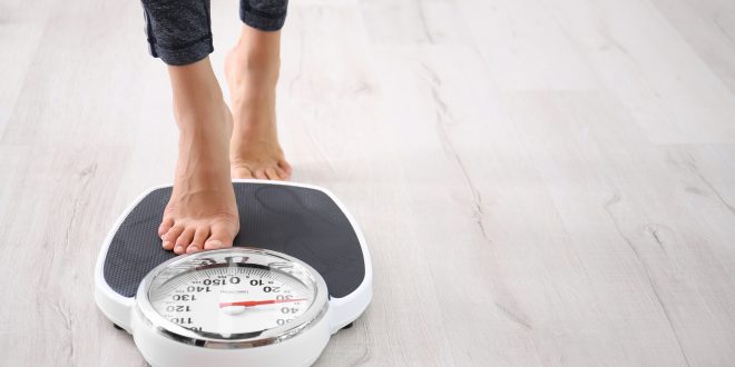 person on scales