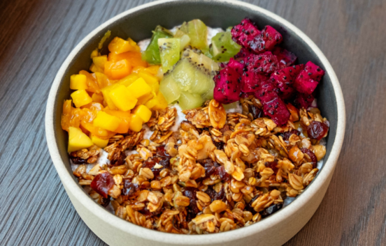 image shows a bowl containing oat cereal and fruit