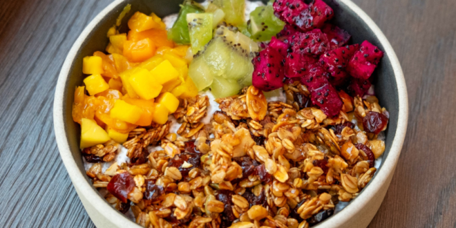 image shows a bowl containing oat cereal and fruit