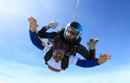 Two men fundraising through a skydive